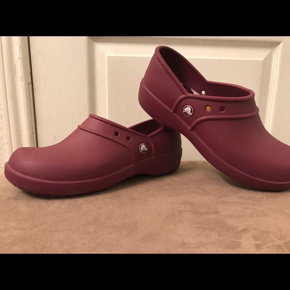 Purple Crocs clogs.
